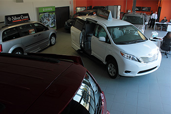 Three accessible vans in Silver cross automotive showroom