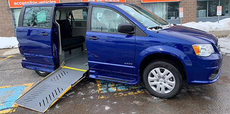 Blue Dodge grand caravan with side entry wheelchair ramp